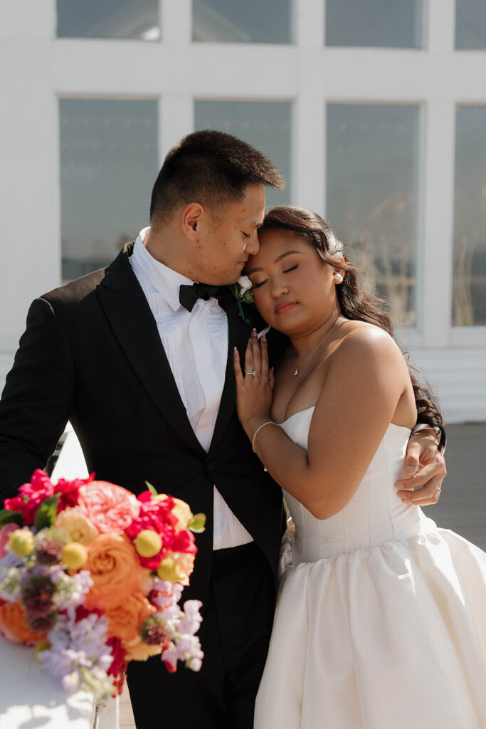 romantic bride and groom portraits by the lake in maryland