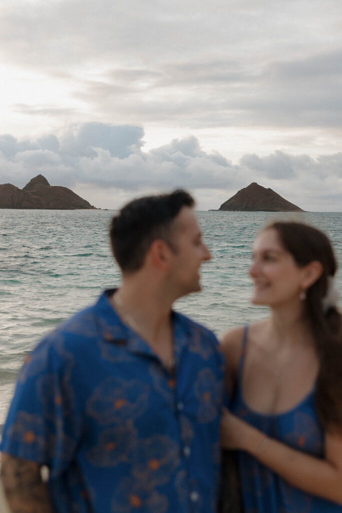 blurry couple photo with ocean background