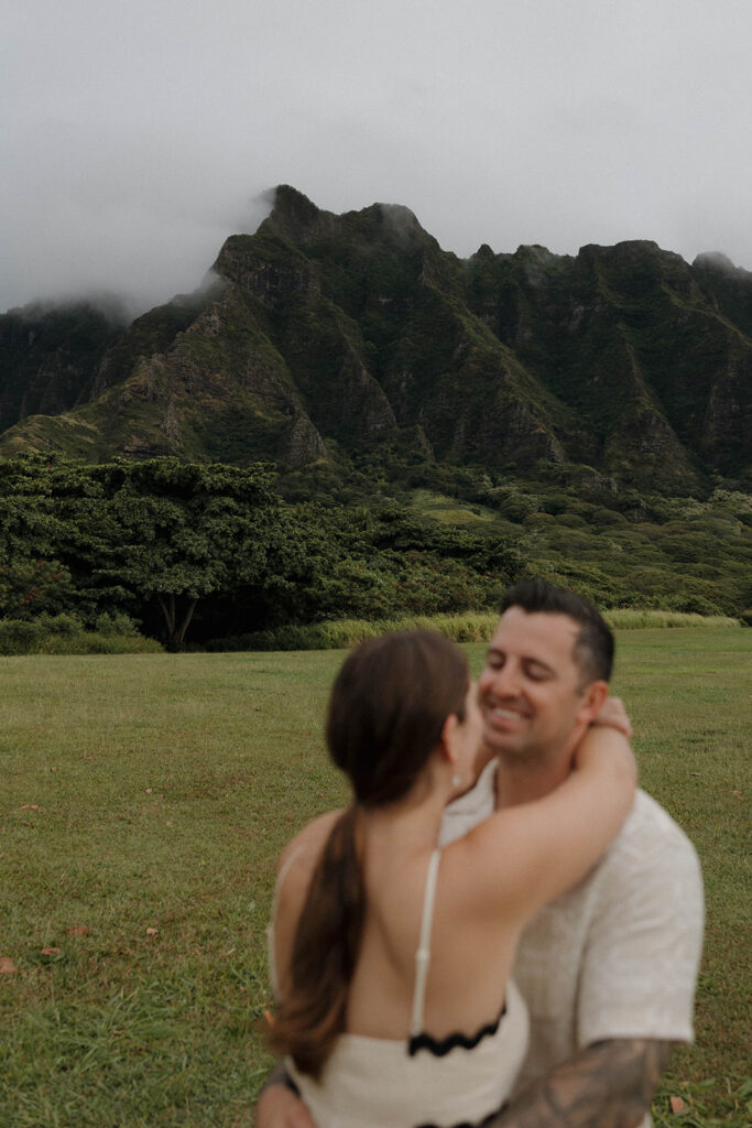 Kualoa Regional Park couples photoshoot in front of the mountains