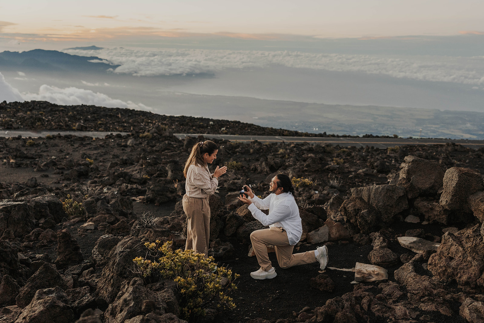 a man proposing with en epic view at one of Maui's best engagement photo locations
