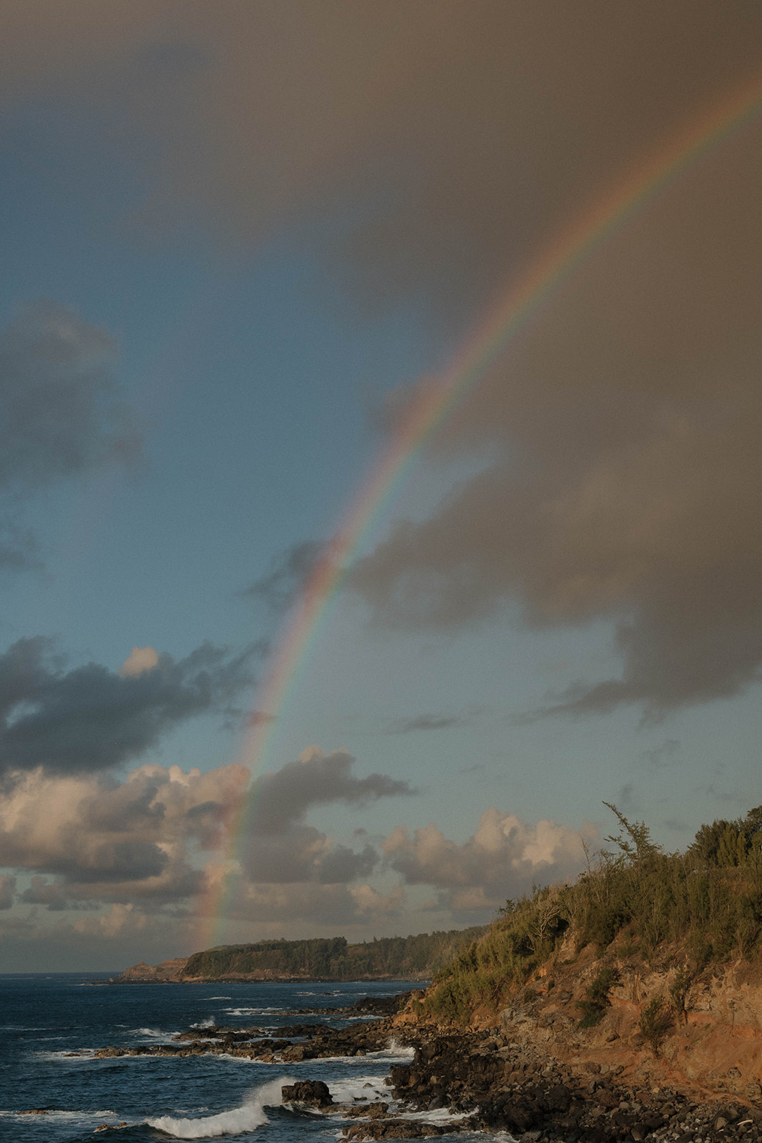 a rainbow over the ocean at a secret  Maui proposal location