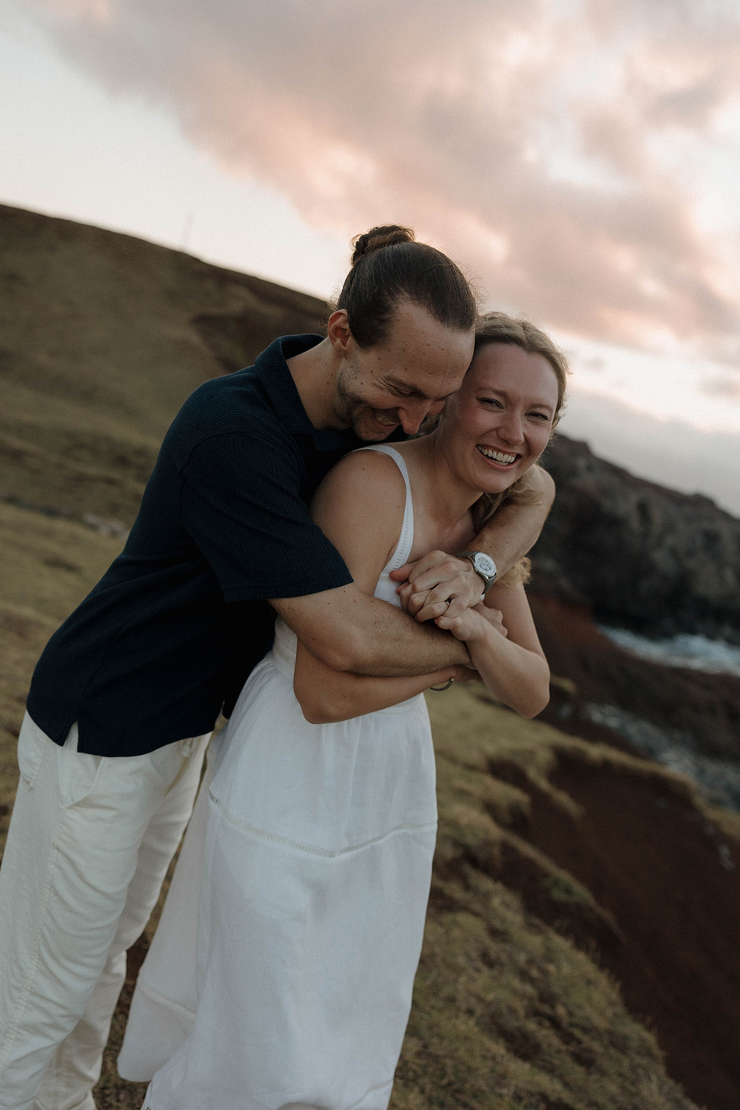a man hugging a woman from behind during their Maui proposal photos