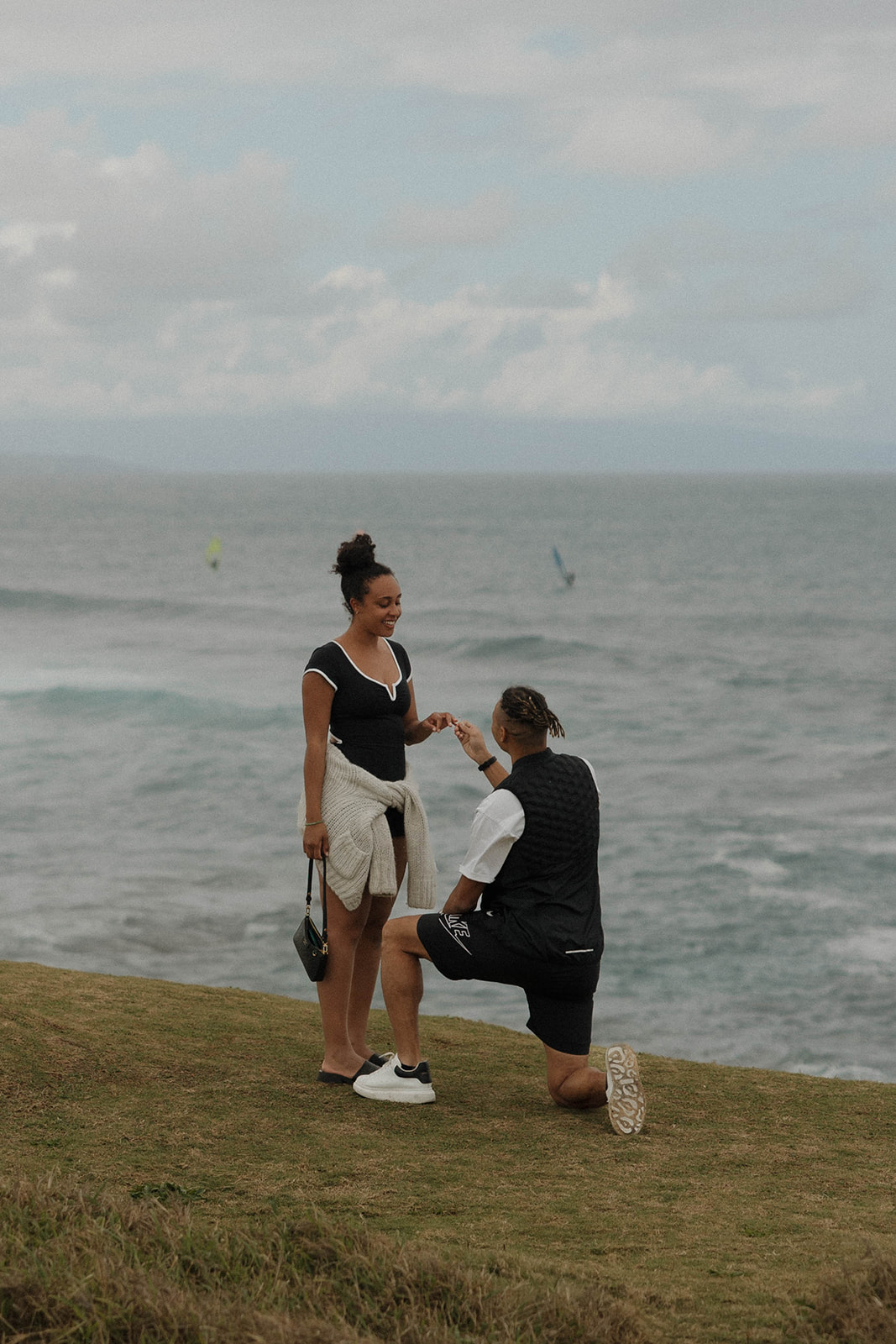 a man down on one knee at one of Maui's best engagement photo locations