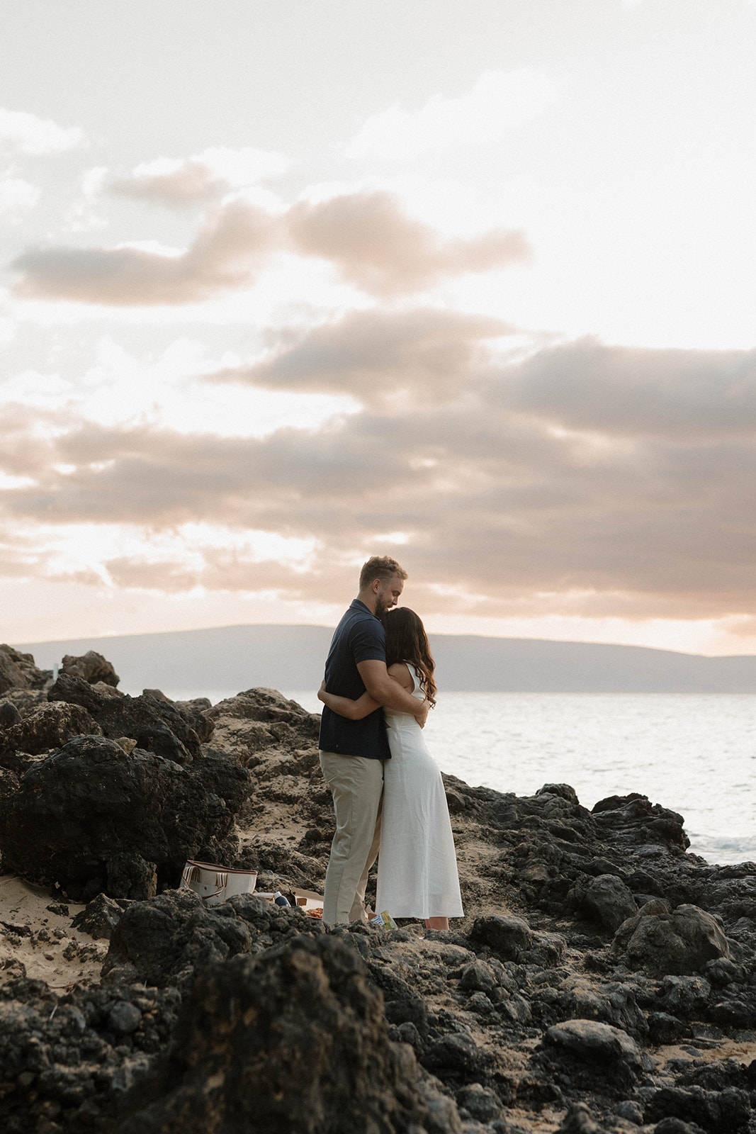 a couples photoshoot on the beach after their engagement in Maui 