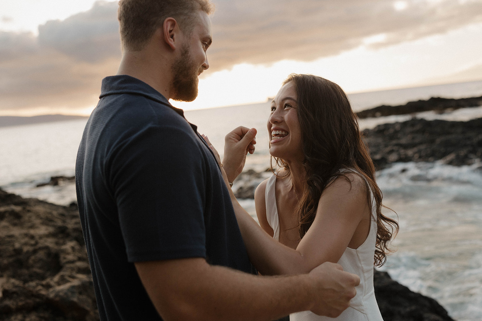 a couple smiling after they just got engaged at one of Maui's best engagement photo locations
