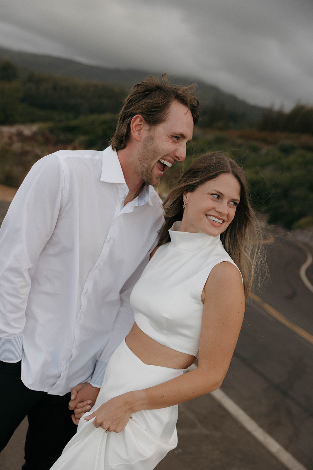 a candid couples photo of them laughing 