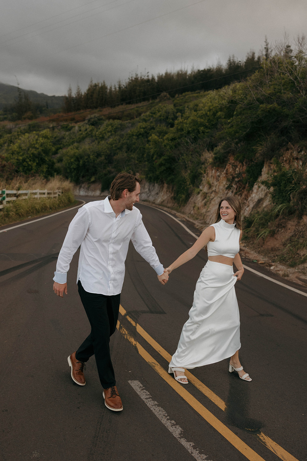 a couple wearing the perfect engagement photo outfits in Hawaii 