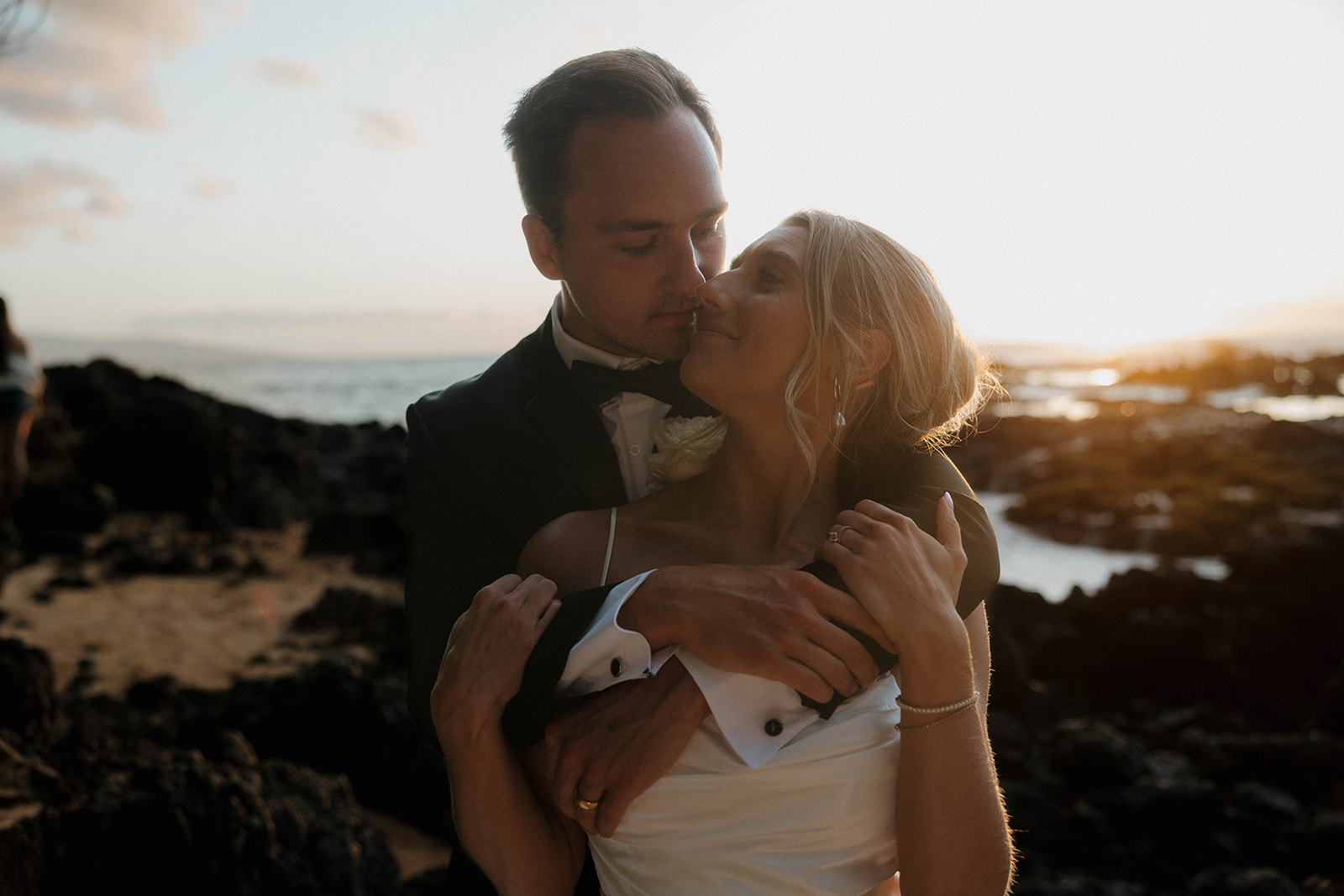 bride and groom putting their faces together intimately 