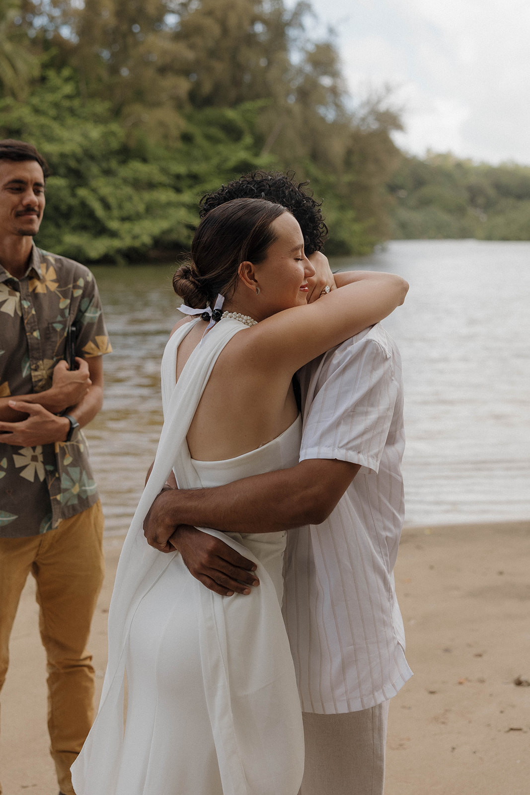 The newlyweds hugging during their micro wedding in Kauai ceremony.