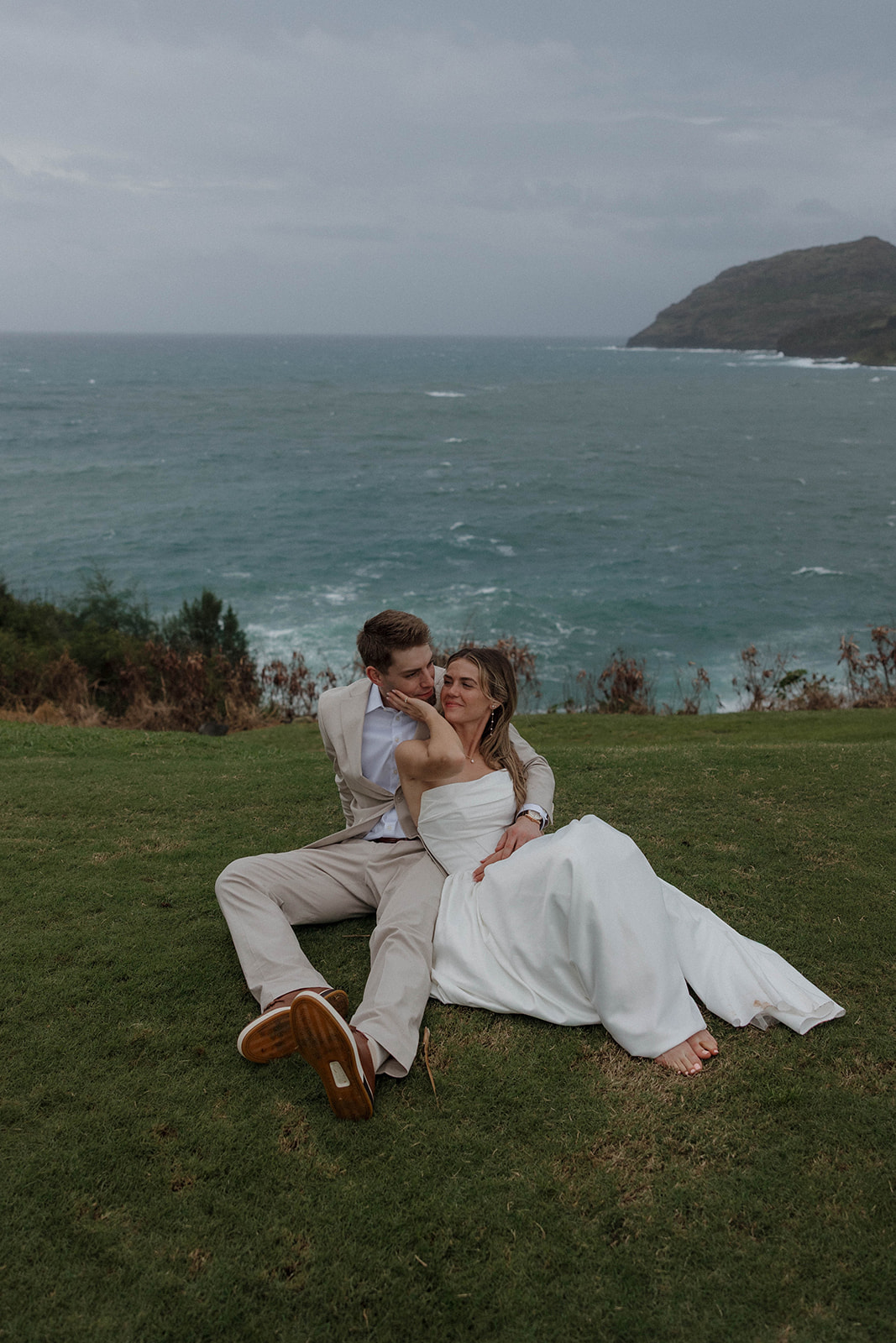 Coastal cliffside couples portraits overlooking the ocean captured during their Micro Wedding in Kauai